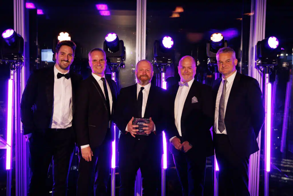 Allan holding the Dotties Award with Matt and the Dotdigital team