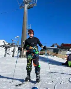 Darragh, Customer Success Associate, ready to ski on a sunny day.